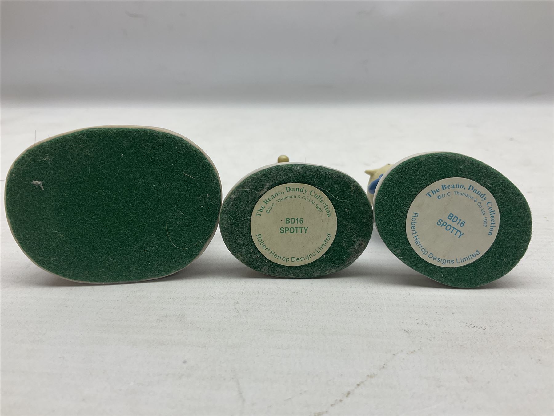 Eleven Robert Harrop figures from the Beano Dandy collection, comprising One Man & His Dawg BDS08, Picnic Desperate Dan BDS04, Fatty BD07, Desperate Dan BD03, Roger the Dodger BD20, Dennis the Menace BD01, Beryl the Peril BD05, Minnie the Minx BD04, Surfing BP03, two Spotty BD16, together with a Genuine Beano Ware lidded box (12)