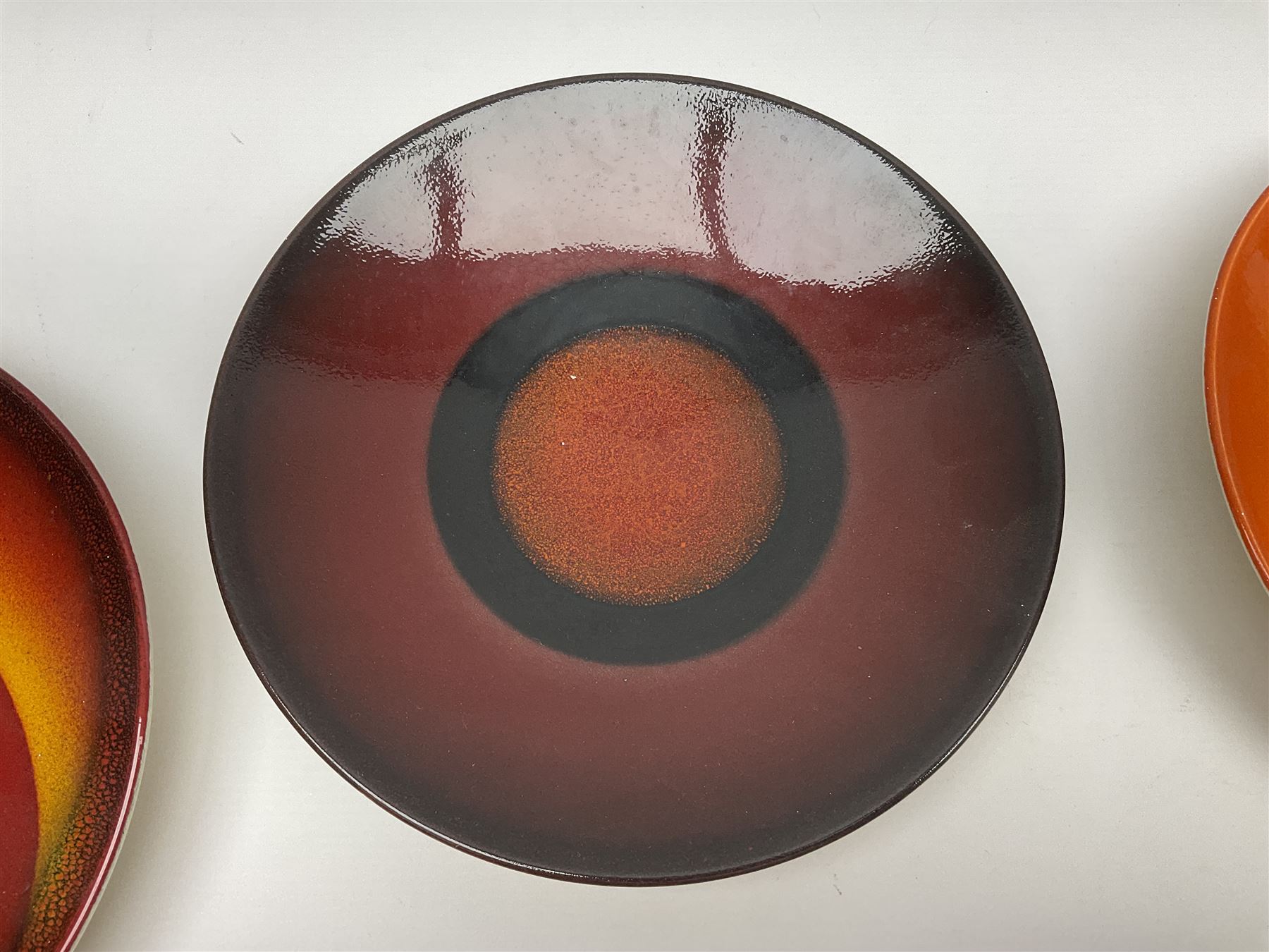 Poole Pottery The Planets, set of nine chargers 'The Planets, by Alan Clarke, comprising Mars, Mercury, Neptune, Venus, Uranus, Pluto, Jupiter, Saturn and Earth, all with original boxes and certificate, D27cm 