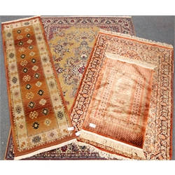  Persian style dark beige ground rug, central medallion (240cm x 170cm), a runner rug and two other rugs (4)  
