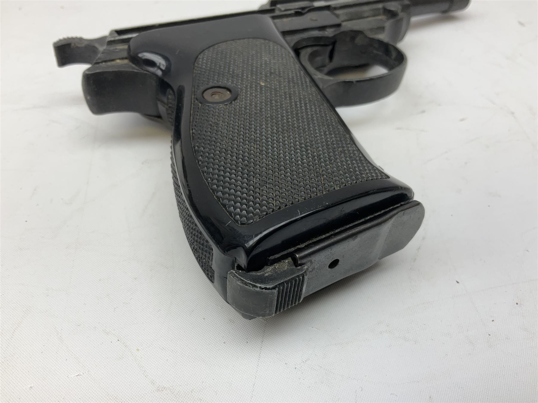 Modern Remington .44 calibre percussion brass framed army revolver, possibly by Uberti, with 16cm octagonal barrel, No.225; partially deactivated to old specification with no certificate L36cm overall; together with a die-cast copy part model of a Walther P38 semi automatic pistol (2) RFD ONLY