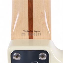 Fender Stratocaster electric guitar, serial no. P093223 made in Japan c.1993, with cream body, white scratch plate, maple neck, three pickups, three control dials and five way selector switch, in a black Fender USA hardcase, guitar L99cm