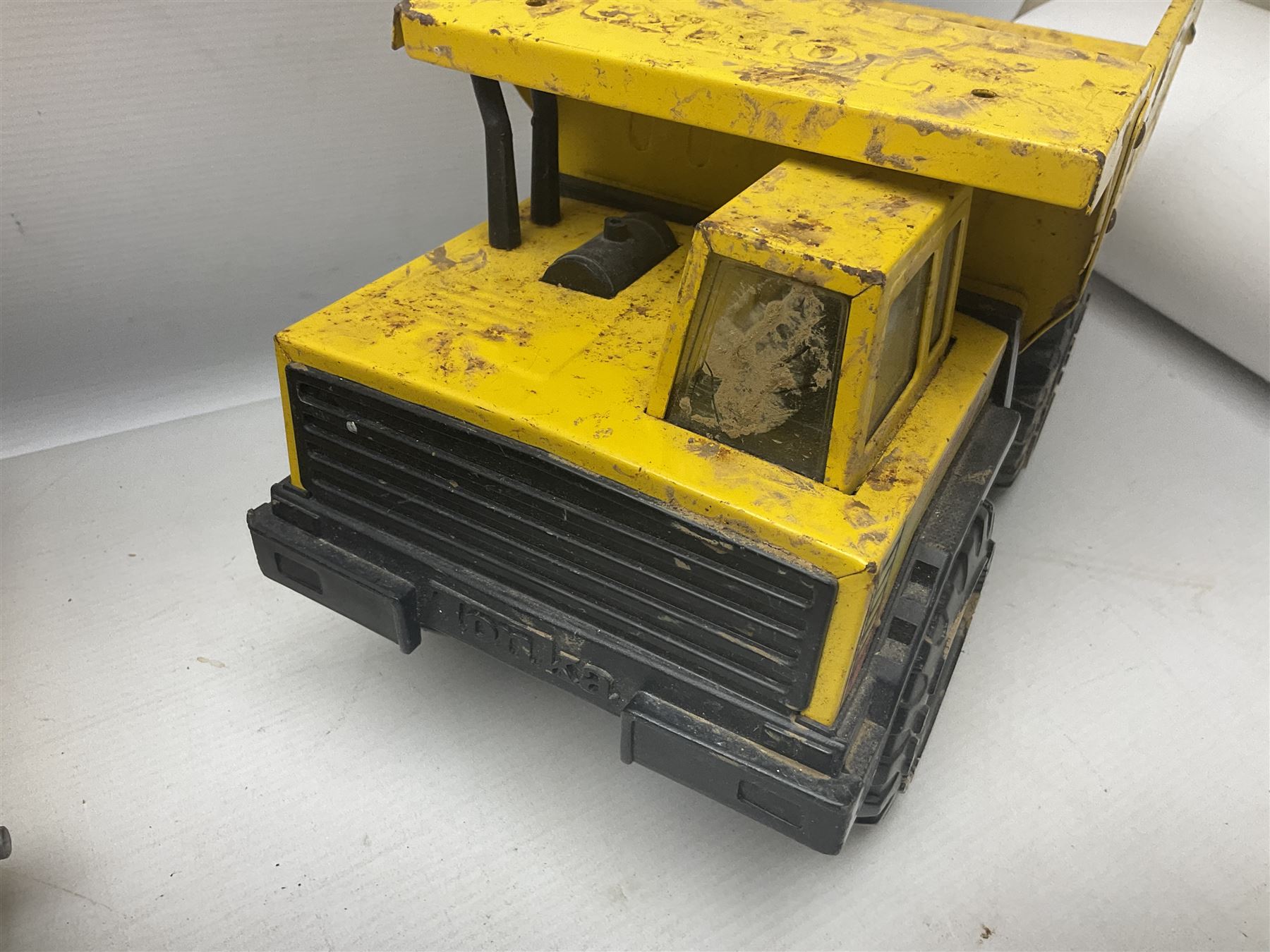Tonka - five large scale pressed steel vehicles comprising Cement Mixer, Mobile Crane, Bulldozer and two Dumper Trucks (5)