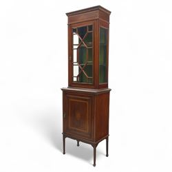 Edwardian inlaid mahogany display cabinet, the moulded cornice above an astragal glazed door enclosing two baize lined shelves, the lower section with a panelled cupboard door, raised on square tapering supports