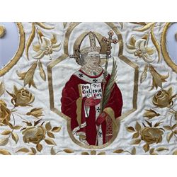 Silk embroidered panel depicting a Pope figure holding Pro Ecclesia Dei book with a sword behind his head, worked with gold coloured thread and roses, housed gilt frame, H74cm W90cm