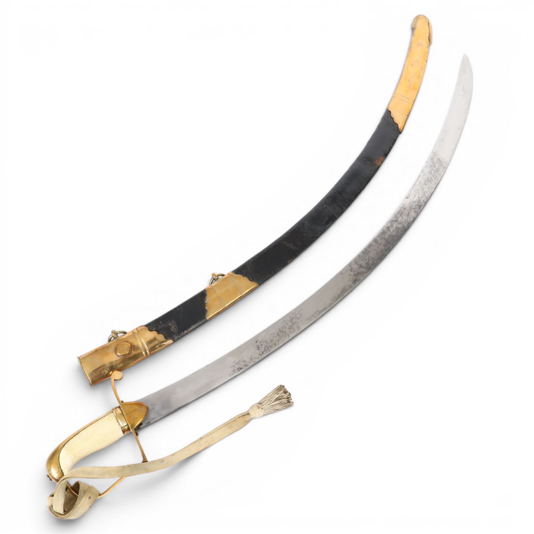 British 1976 pattern cavalry officers' saber variation of  private purchase, the 76cm single edged blade extremely curved, brass stirrup hilt with chequered ivory grip the languets bearing military trophies, with original buck skin sword knot, the leather scabbard has three brass mounts with twin suspension rings, the top mount bears makers cartouche of 'Tatham to his Majesty, Charing Cross London', 1800-1860, overall L90cm  This item has been registered for sale under Section 10 of the APHA Ivory Act 