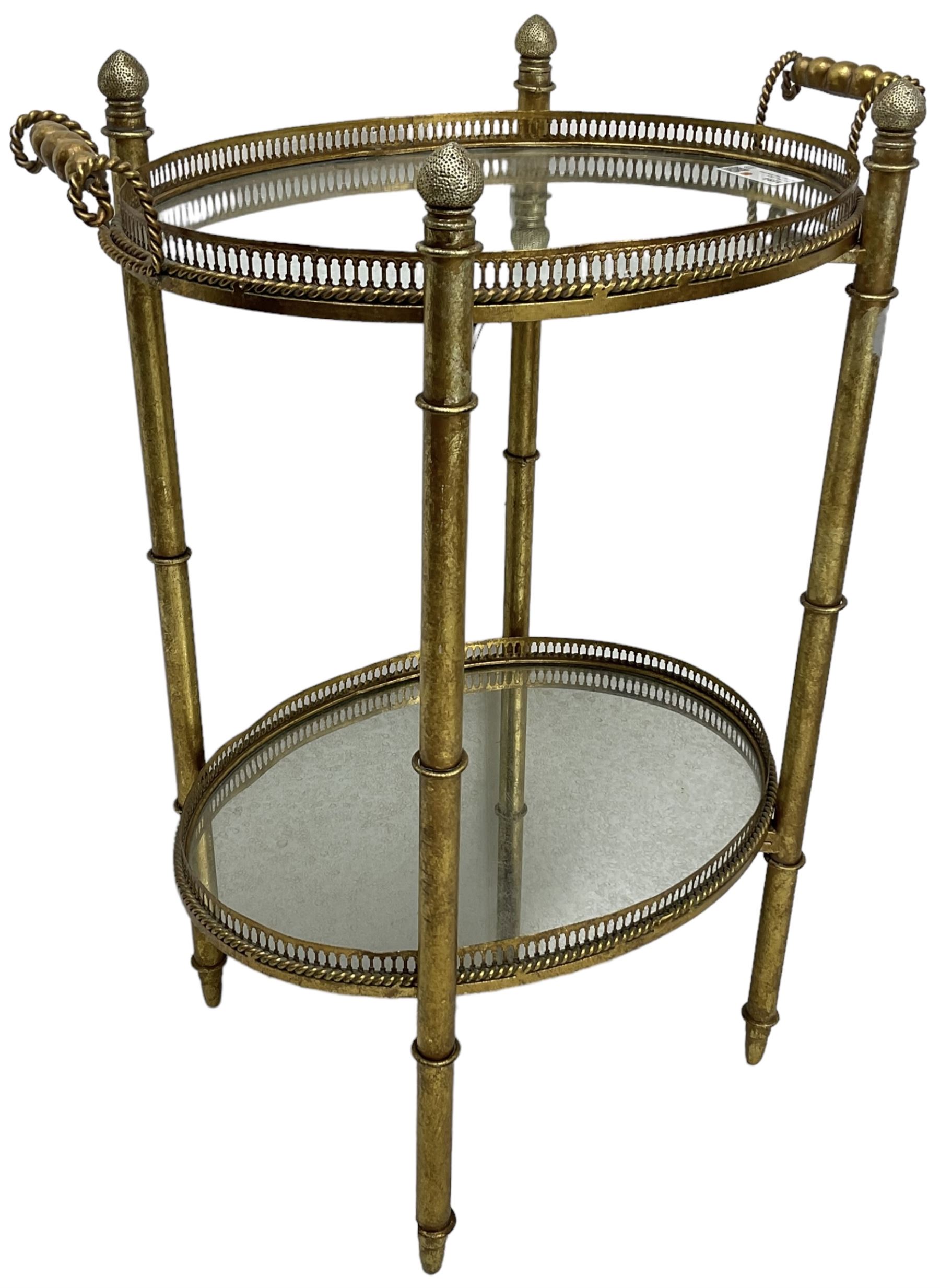 Gilt metal oval stand, two mirrored tray tiers with raised pierced galleries
