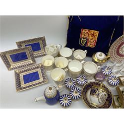Commemorative ware Including five green and gold Highgrove limited edition hand embroidered tree decoration, a collection of ceramic ware from the royal collection including four cups and saucers, small teapot,    three trinket trays, five trinket pots with lids, eight tot glasses, three William Edwards Queens 80th cup, Hudson & Middleton hinged box etc. 
