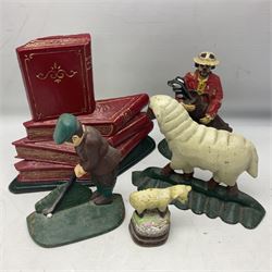 Five cast metal and painted doorstops including golfer etc