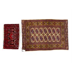 Persian Bokhara fuschia ground rug, field decorated with Gul motifs surrounded by guarded border (121cm x 79cm); and red prayer matt