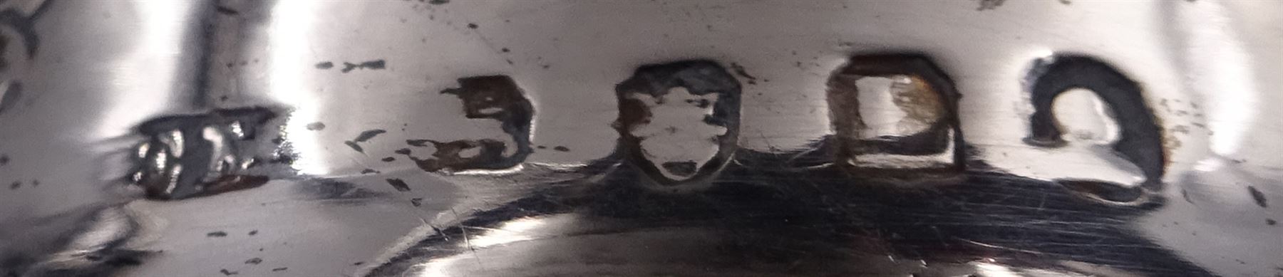 George III silver cream jug, of helmet form with angular handle, embossed with floral and scrolling decoration and engraved initial, hallmarked Edward Mayfield, London 1806, H9.3cm, together with a modern silver 'Sherry' decanter label, hallmarked Birmingham Mint, Birmingham 1986