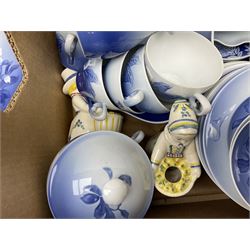  Bing & Grondahl, Copenhagen blue and white Christmas Rose pattern tea wares, to include teapot, covered sucrier, milk jug, fourteen cups and seventeen saucers, etc, together with two Royal Copenhagen collectors plates etc  