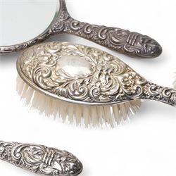 Pair of silver backed hand mirrors, clothes brush and hair brush (4)