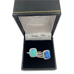 Two silver opal and cubic zirconia cluster rings, stamped or hallmarked, in one box