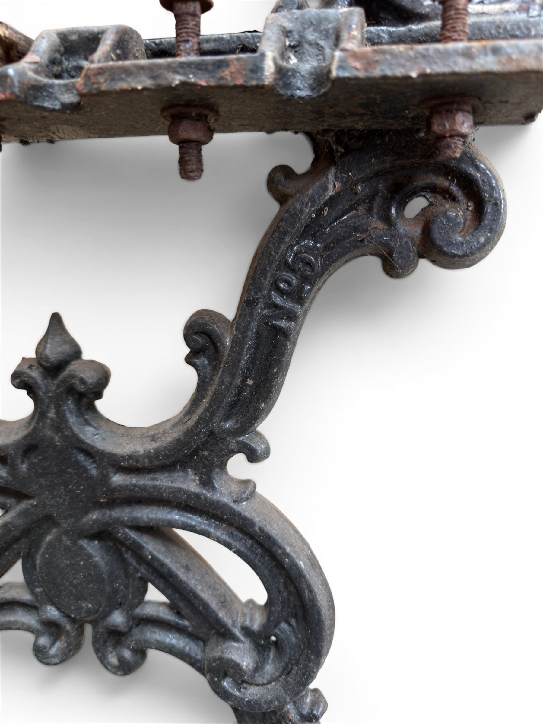 Carron Foundry - two pairs of 19th century cast iron garden bench ends, ornate detail with arms and X shaped legs,finish in black paint, the design no. 110396, first registered 13 July 1857 (see illustration), width as desired