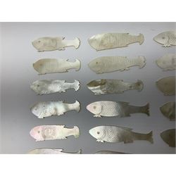 Collection of fifty two Chinese mother of pearl gaming counters or tokens, of various size and form including rectangular, circular and fish shaped examples, various decoration including floral motifs, largest rectangular examples L4cm