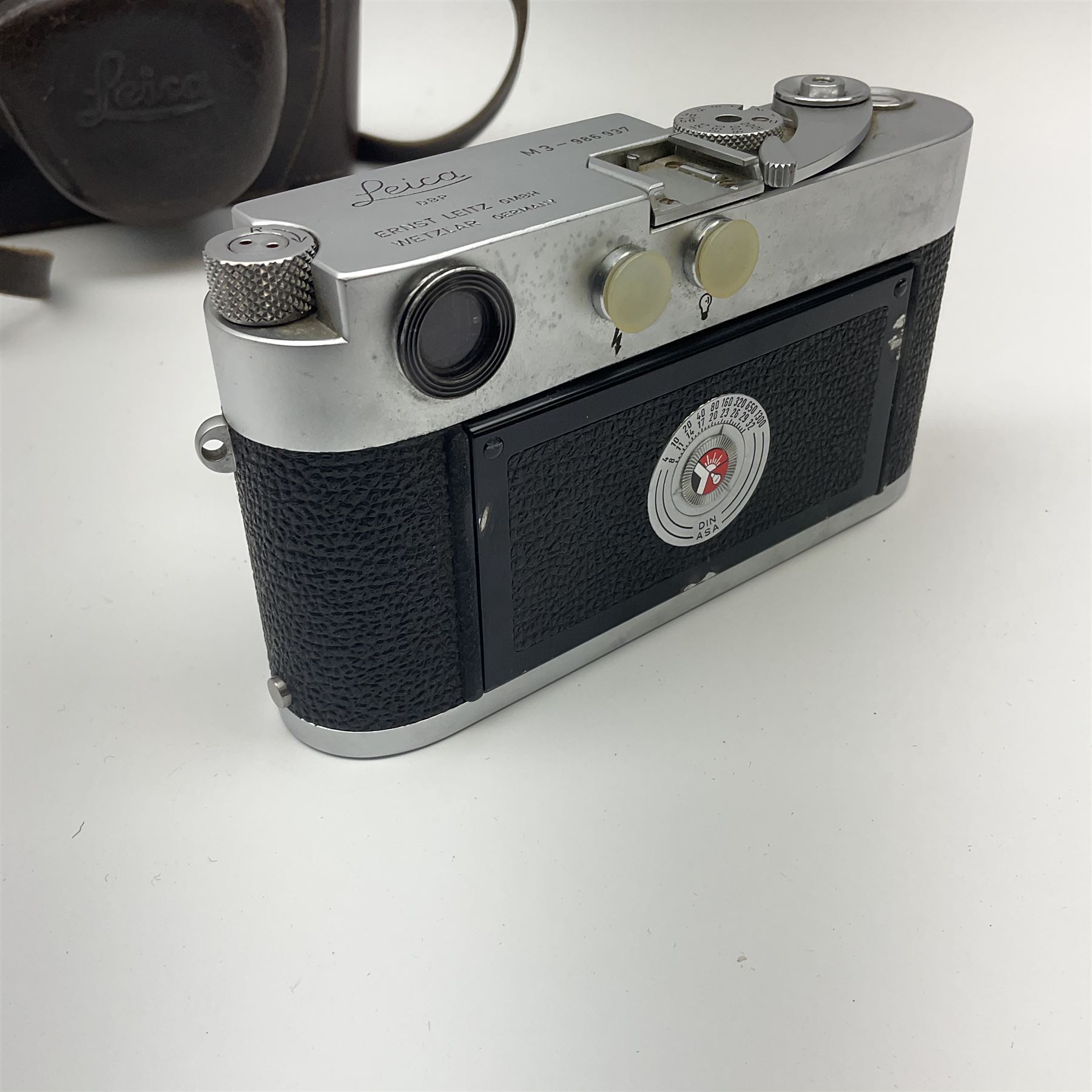 Leica M3 camera body, 1959, chrome finish, serial number '986937', fitted with 'Ernst Leitz GmbH Wetzlar Summicron f=5cm 1:2 Nr.1592614' lens, with Leica M3 instruction booklet