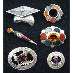 Collection of Victorian and later silver brooches, including blue agate graduation mortarboard brooch, registration lozenge dated 1865, two purple stone thistle brooches by Ward Brothers and three other hardstone brooches, stamped, hallmarked or tested