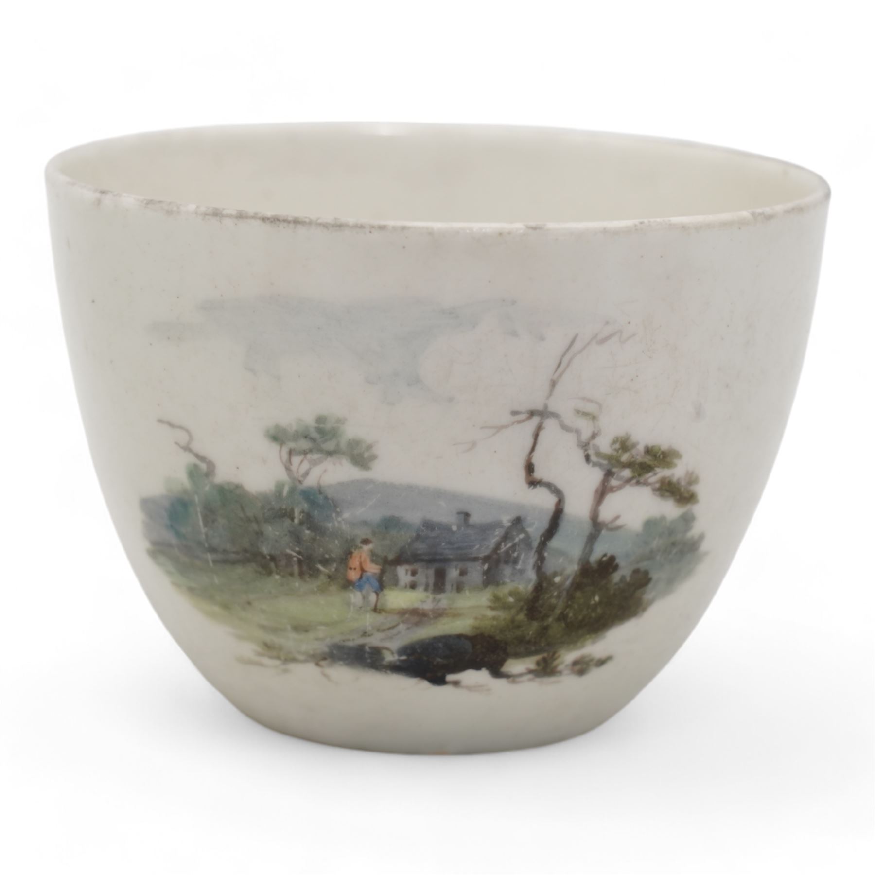 Set of four Pinxton porcelain bute shaped teacups and saucers, circa 1796-1813, pattern no. 218, painted in polychrome with landscape panels within gilt rims, possibly by John Cutts, three pieces numbered 218 beneath, saucer D14cm, teacup H6cm (8)