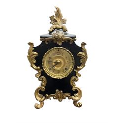Ansonia - American late 19th century steel cased 8-day mantle clock in a Rococo case with decorative brass mounts, brass dial with Arabic numerals, steel hands and a repousse dial centre, twin train striking movement sounding the hours and half hours on a gong. with pendulum and key.