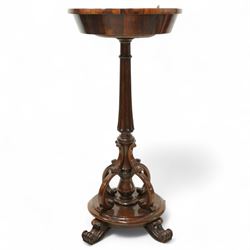 An early Victorian rosewood plant stand with removable marble top, with metal interior liner, circular top above fluted column with arched scroll supports on turned base with scroll feet 
