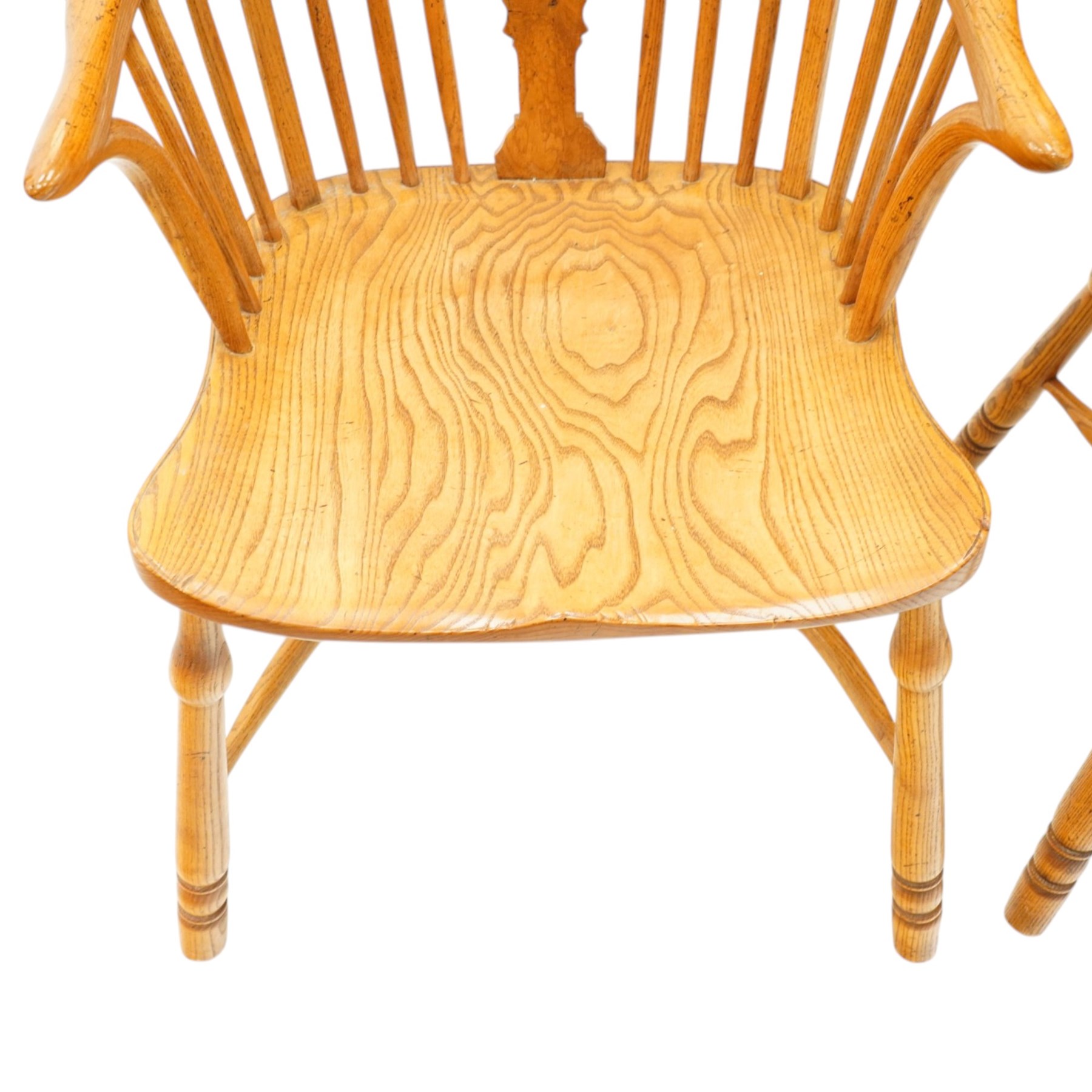 Quality set of six (4+2) golden figured and burr oak Windsor chairs, the yoke-shaped cresting rail over a vasiform shaped splat and spindle back, shaped saddle seat raised on turned supports united by crinoline stretcher