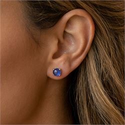 Pair of 9ct gold cabochon round cut sapphire stud earrings, stamped