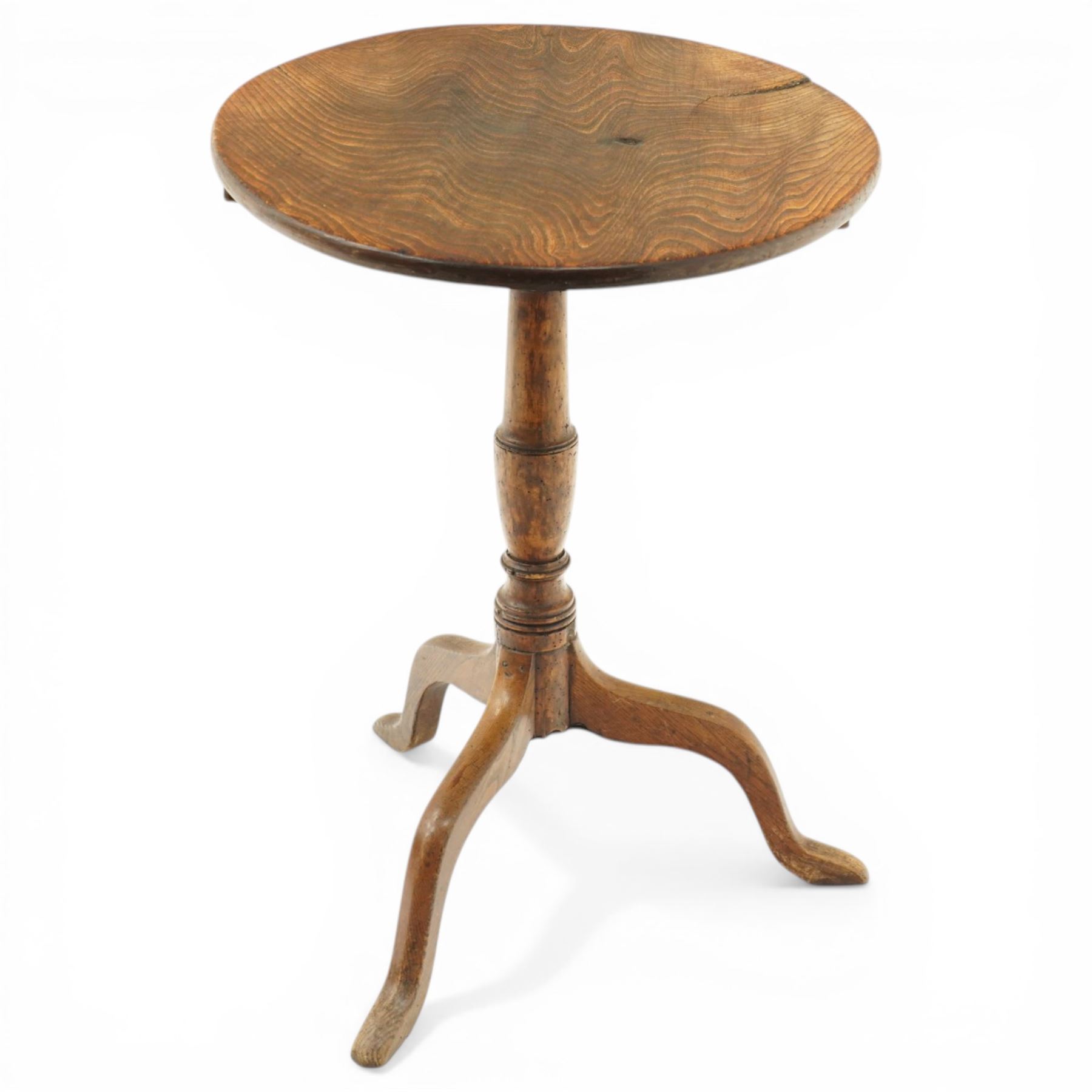 George III figured elm wine table with oval flip-top, raised on turned vasiform pedestal with tripod base