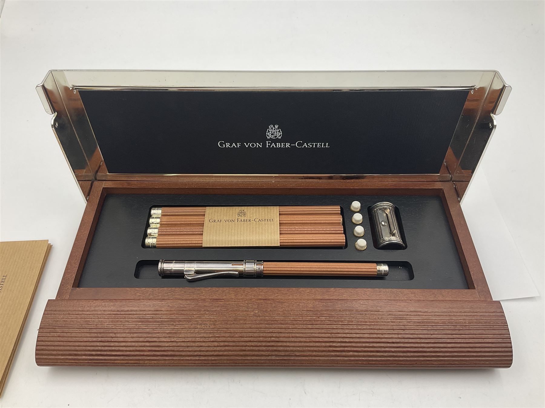 Graf Von Faber-Castell Pencil Cassette, housed in alder wood presentation box with mirrored hinged lid, containing platinum plated Perfect Pencil, sharpener, four erasers and four replacement pocket pencils with native alder handles hand-selected by Nuremberg woodcarvers, with certificate, cloth and original green box
