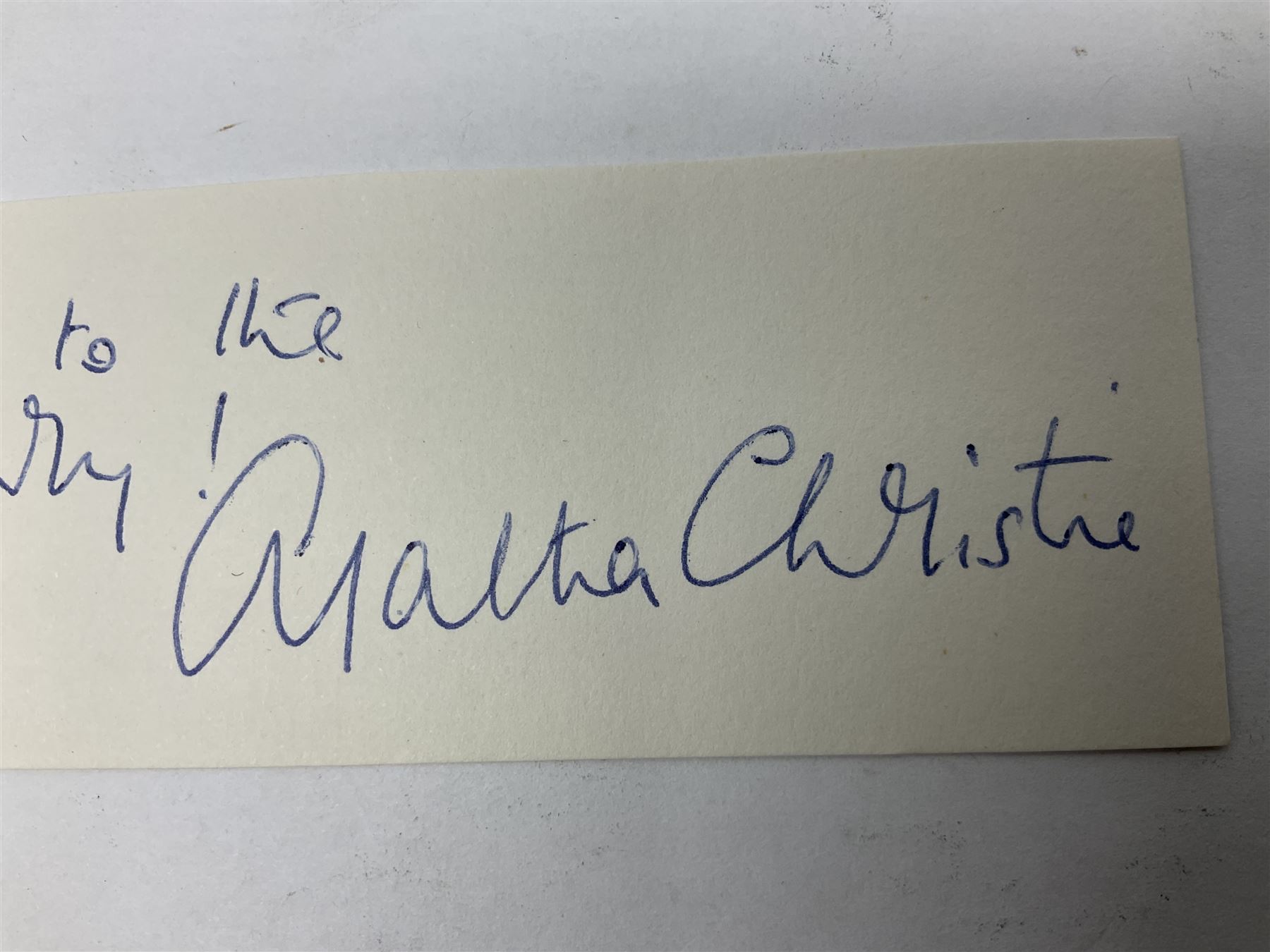 Christie  Agatha (1890-1976) English Crime Novelist. Blue ink signature with inscription 'My respects to the Queen Mary'; oblong clipping