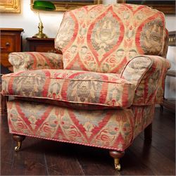 Duresta - traditional shape armchair with out-swept arms, upholstered in crimson ground fa...
