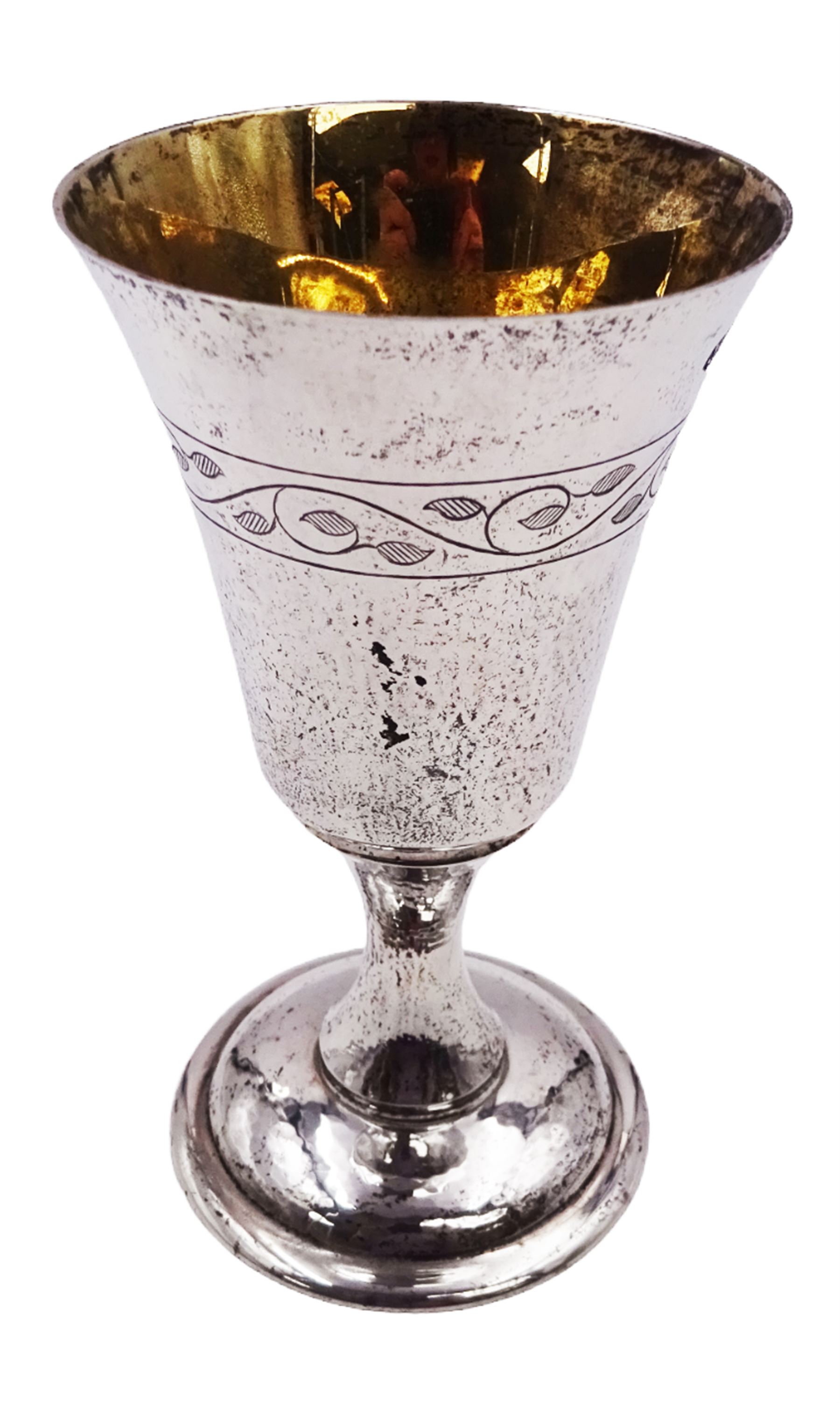 Modern limited edition silver goblet, a replica of the original silver chalice of Lincoln Cathedral, with hand planished decoration, and engraved band of laurel leaves to bowl, with gilt interior, upon waisted stem and circular stepped foot, no. 144/200, hallmarked John Cussell, London 1977, H15cm