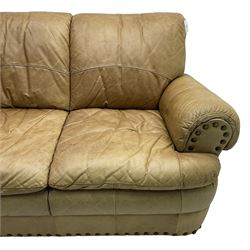 Large three-seat sofa upholstered in stitched brown leather with stud work decoration, rolled back and arms