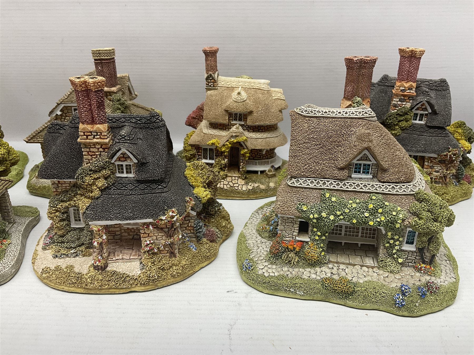 Eight Lilliput Lane limited edition Beatrix Potter models, including Buckle Yeat, Tabitha Twitchits Shop and Ginger Pickles Shop, together with twelve Lilliput Lane models from the Blaise Hamlet collection, including Dial Cottage, Diamond Cottage and Vine Cottage, all with deeds and original boxes (20)