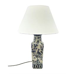 India Jane table lamp, decorated with blue birds and floral vines upon a white ground, fitted with a cream lampshade, H62cm 