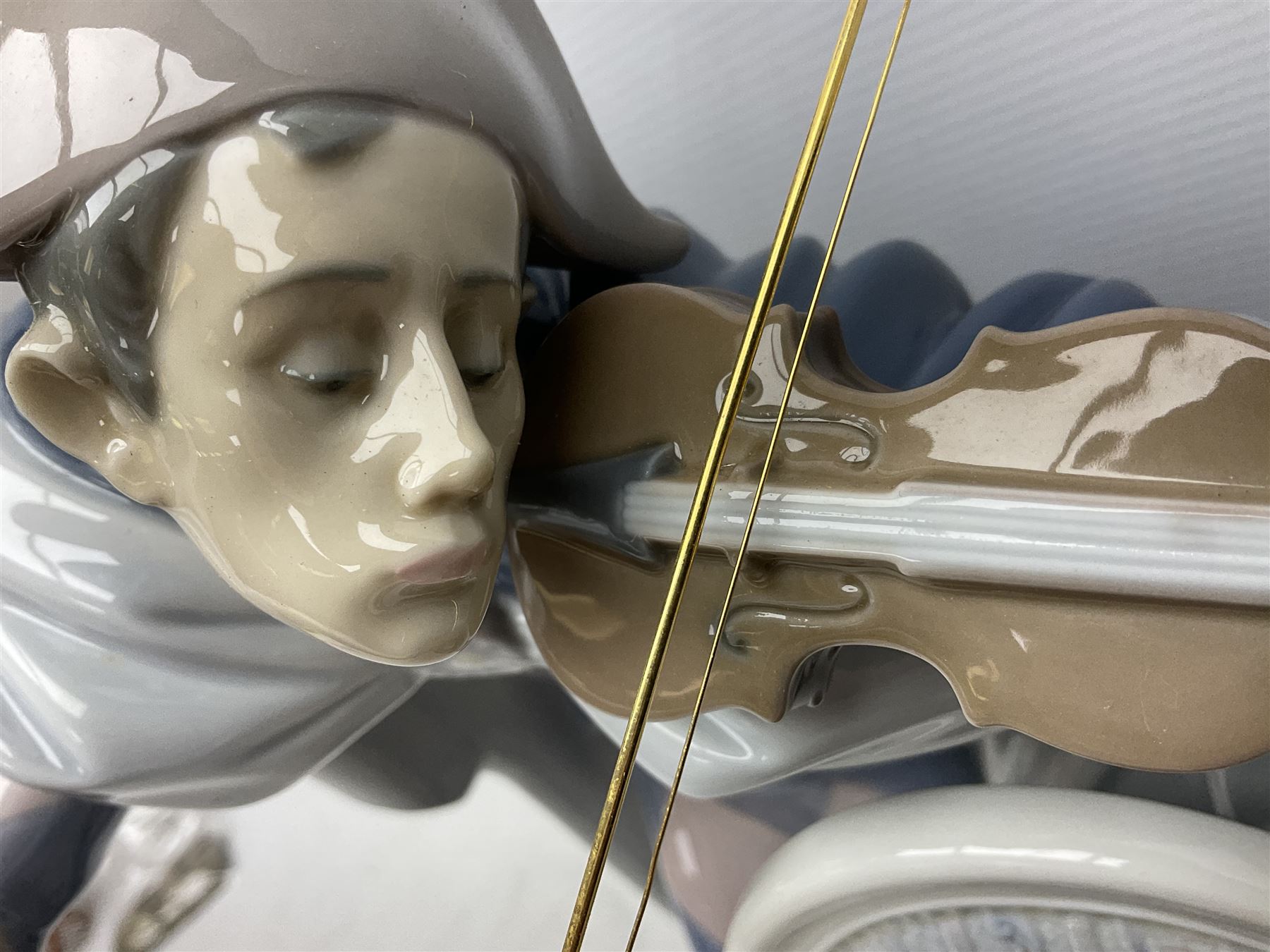 Lladro figure, Jester Serenade, modelled as a ballerina with bouquet of flowers seated before a jester playing the violin, limited edition 2541/3000, sculpted by Antonio Ramos, no 5932, with original box, year issued 1993, year retired 1994, H37cm