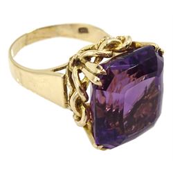 Large gold single stone amethyst ring, with knot design gallery, stamped 9ct