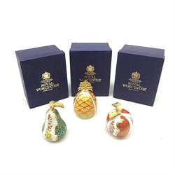 Three boxed Royal Worcester candle snuffers from The Connoisseur Collection, each modelled as a fruit with gilded stem, comprising pineapple, apple and pear, each with printed mark to interior, tallest H11cm. 