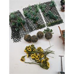 1:12 scale dolls house allotment and garden accessories, including wooden shed on a stone effect base, two vegetable patches, terracotta plant pots with flowers and foliage, stone effect plant pots, other planters, loose sunflowers, scarecrow, rabbit hutch, garden tools, fencing panels, etc 