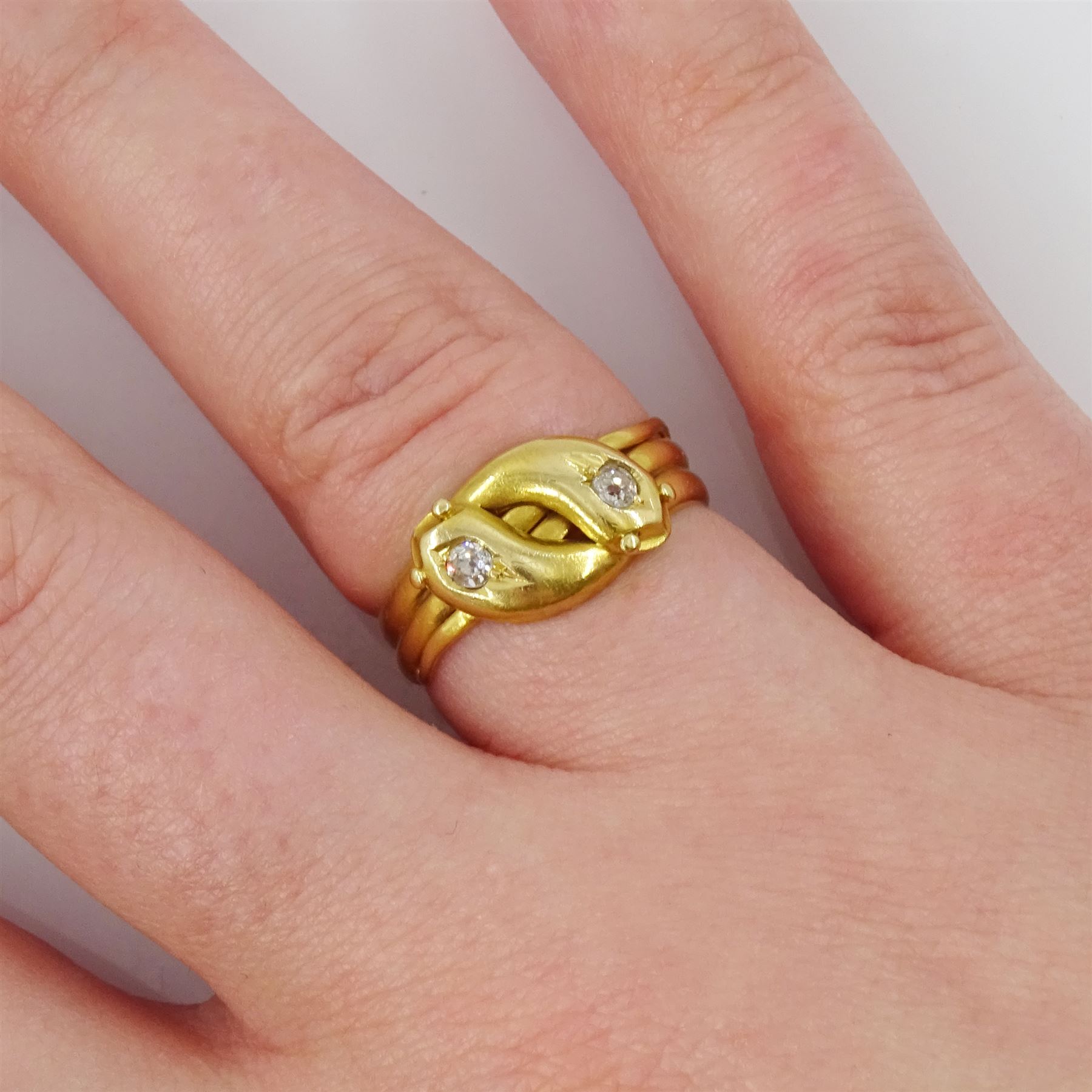 Victorian 18ct gold diamond double coiled snake ring, with an old cut diamonds set in each head, Birmingham 1890, total diamond weight approx 0.10 carat