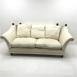 Knole style two seat sofa, upholstered in a beige fabric, turned supports, W200cm 
