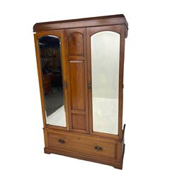Edwardian walnut double wardrobe, fitted with two bevelled mirror panelled doors, single drawer to base