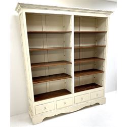 Laura Ashley Bramley range French style cream painted open bookcase, eight adjustable shelves above four drawers, shaped plinth base