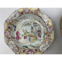 Two 19th century Chinese dishes with painted polychrome decoration, depicting joyous figures in a garden setting in circular central recess surrounded by border with lattice, blossoming branches and gilt panel decoration, D15.5cm
