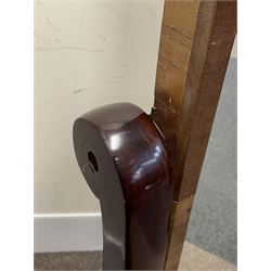 Early 19th century mahogany cheval dressing mirror, plain mirror plate within chamfered frame with arched top, on rolled horns and out-splayed rolled feet, united by turned stretcher 