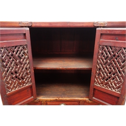  20th century Chinese lacquered cabinet enclosed by four doors, three drawers and undertier below, W119cm, H145cm, D57cm  