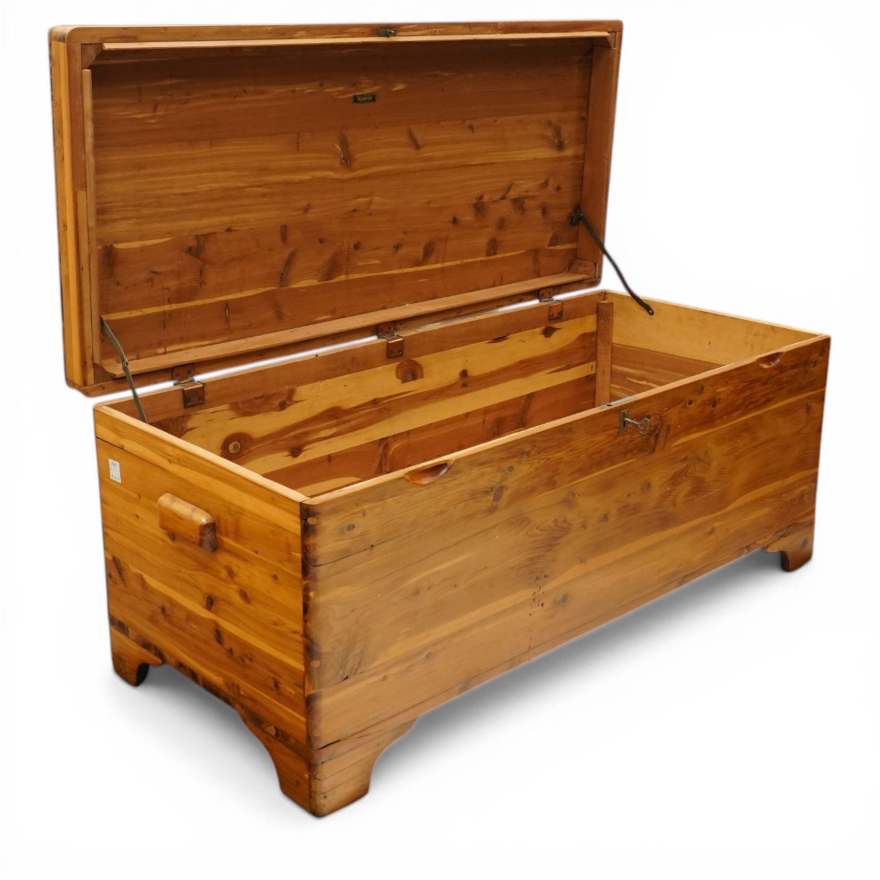 20th century American pine blanket chest, raised on bracket feet, makers label to interior