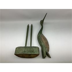 Large wood figure of a standing heron, the bird with an oxidised bronzed appearance