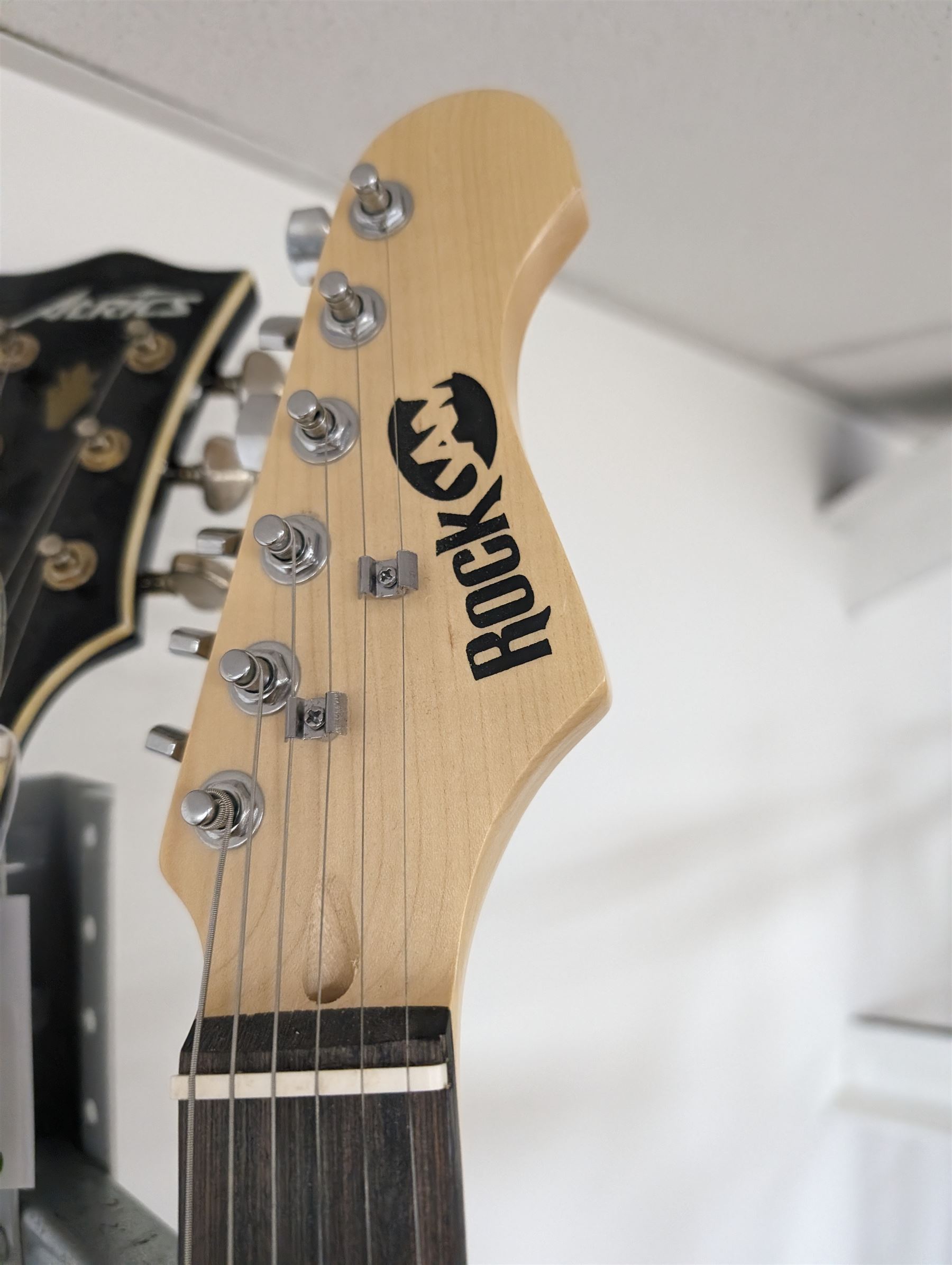 Rock Jam six string electric guitar, together with a Rock Jam amplifier and an Atrics guitar