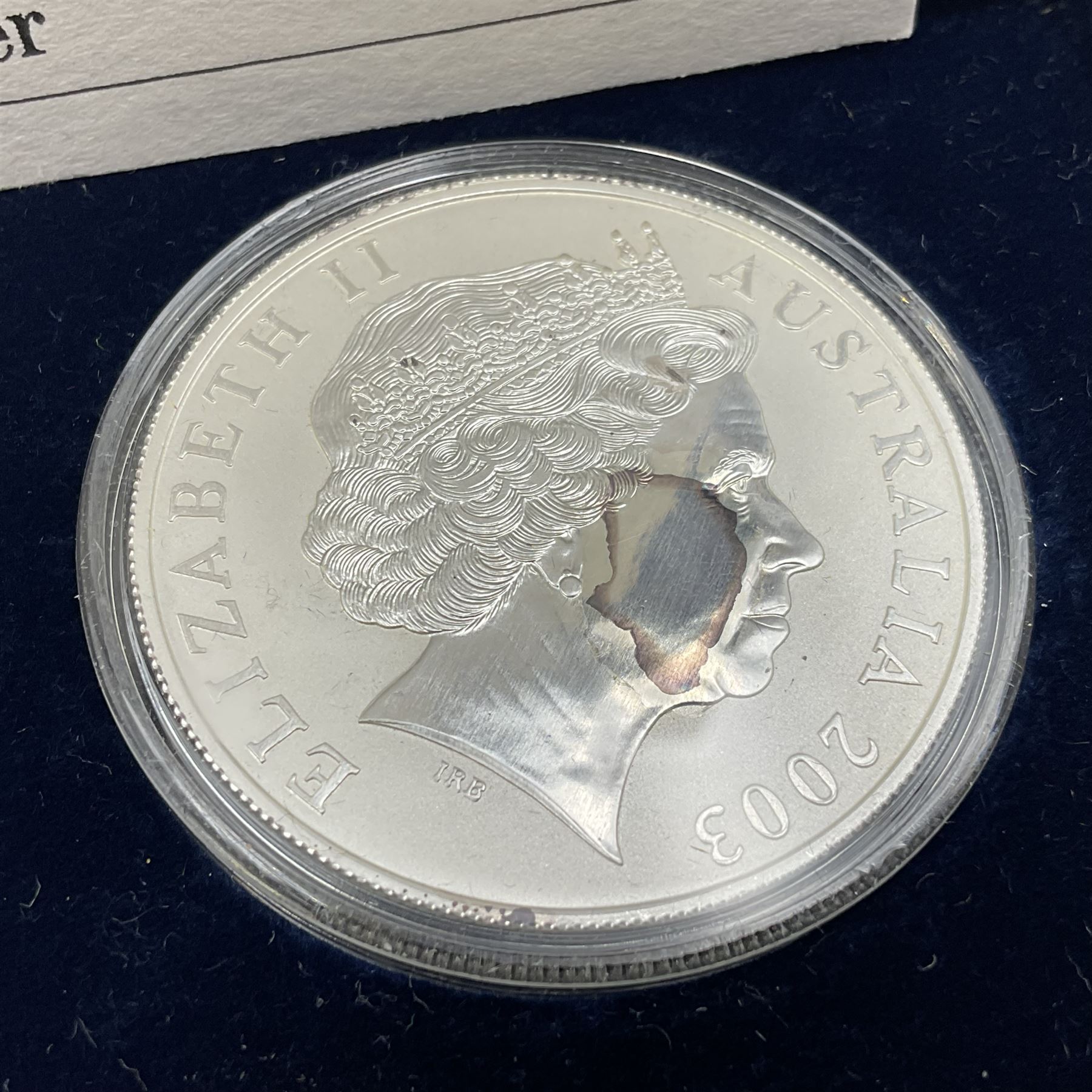 Four one ounce fine silver coins, forming 'The 2003 Famous World Silver Coin Collection', comprising United States eagle, Australian kangaroo, Chinese panda and Canadian maple leaf, cased with Westminster certificate 