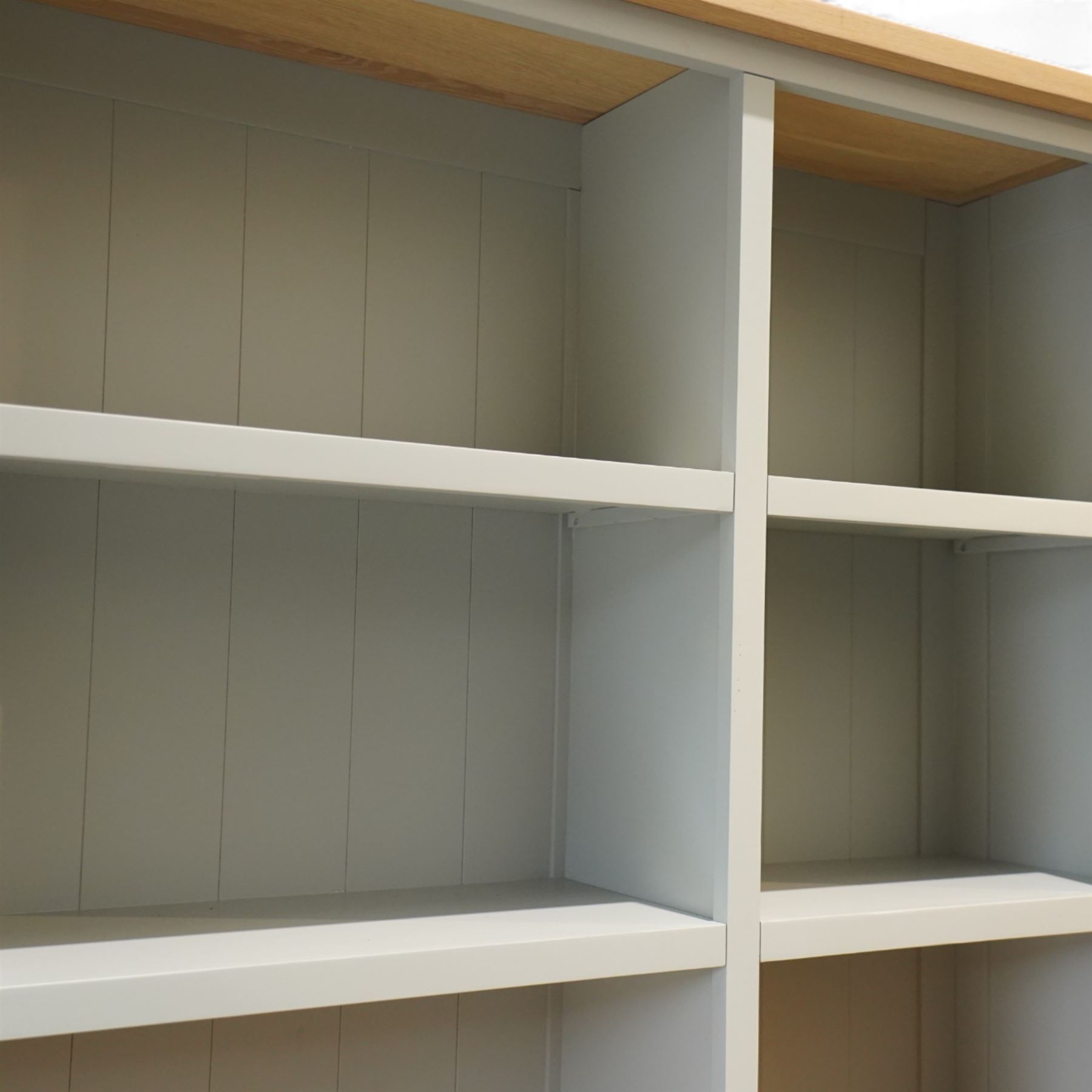 Cotswold Company - 'Chester' dresser painted dove grey with contrasting oak top, the upper rack divided into nine open shelves with panelled back, the lower section fitted with four drawers and cupboard doors enclosing storage compartments